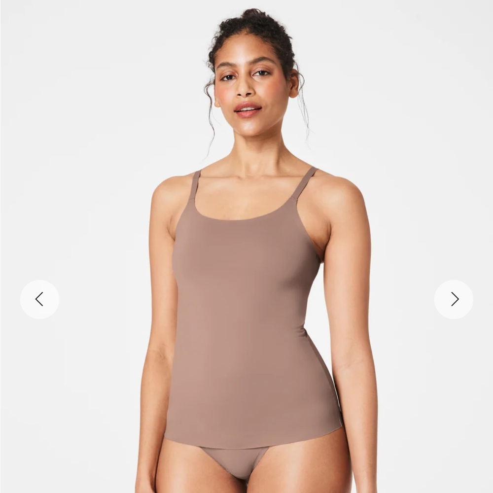 Brand new Spanx cami with tag. Never worn. Med, mocha.